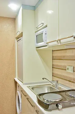 a kitchen with a sink and a microwave at Best Fulya Suites in Istanbul