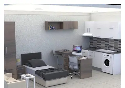 a bedroom with a bed and a desk with a computer at White Palace Apart in Istanbul