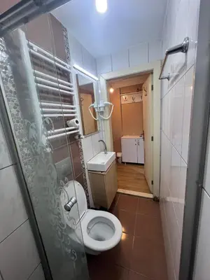 a small bathroom with a toilet and a sink at Taksim White Mansion Hotel in Istanbul