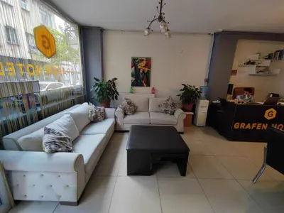 a living room with couches and a table in a store at Grafen Hotel in Istanbul