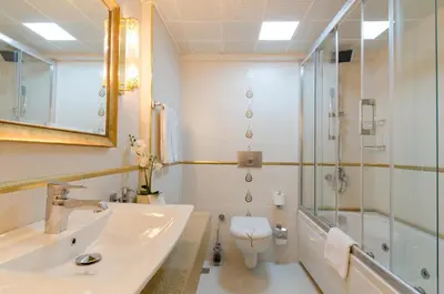 a bathroom with a sink and a shower and a toilet at Arden City Hotel-Special Category in Istanbul