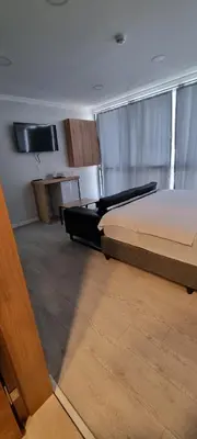 a large room with two beds and a desk at The my hotel darica in Darıca