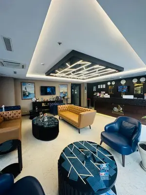 a living room with a couch and chairs and a table at Aprilis Gold Hotel - Special Category in Istanbul
