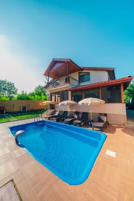 a house with a swimming pool in front of a house at Sepetçi Lakehouse Heated Pool in Kartepe