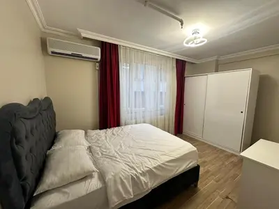 a bedroom with a large bed and a window at Apartment in Sisli Mado14 in Istanbul