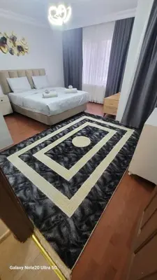 a living room with a black and white rug at شقه الأحلام بمنطقة شيشلى ثلاث غرف وصالون in Istanbul