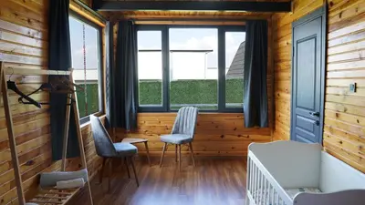 a room with two chairs and a bed and windows at Hilltop Bungalov Sapanca 1 in Sapanca
