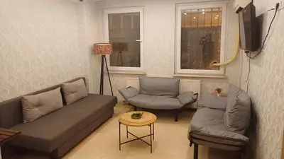 a living room with a couch and two chairs at Nexus By Taksim Hotel in Istanbul