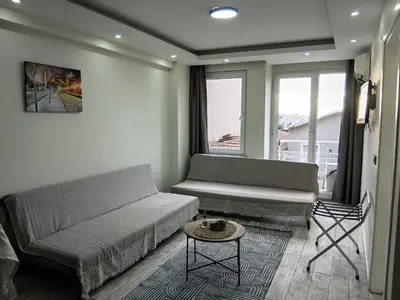 a living room with a couch and a table at Nexus By Taksim Hotel in Istanbul