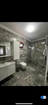 a bathroom with a toilet and a sink at Villa Luna Sapanca in Sakarya