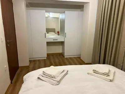 a bedroom with a bed with two towels on it at Modern 2Bedroom Apt in Şişli in Istanbul