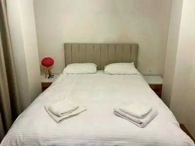 a bed with two towels on top of it at Modern 2Bedroom Apt in Şişli in Istanbul