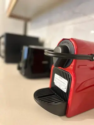 a red toaster sitting on top of a table at Modern 2Bedroom Apt in Şişli in Istanbul