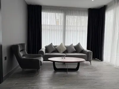 a living room with a couch and two chairs and a table at Hilloria Tatil Köyü in Sapanca