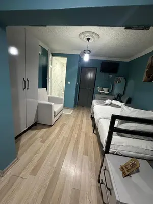 a room with two beds and a couch in it at Ada Apart Otel in Istanbul