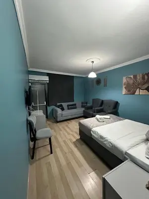 a bedroom with a bed and a couch at Ada Apart Otel in Istanbul