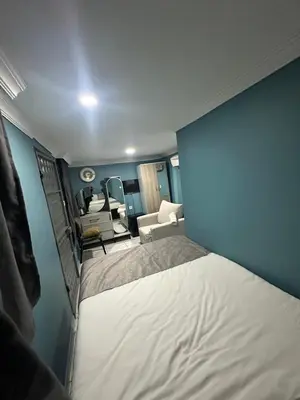 a small room with a bed and a chair at Ada Apart Otel in Istanbul