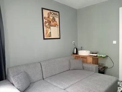 a living room with a couch and a picture on the wall at Murat bey konağı in Istanbul