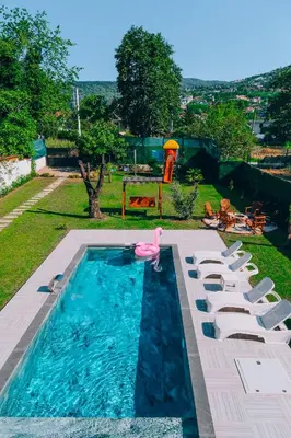 a pool with a pink flamingo in the middle at Villove Sapanca in Sapanca