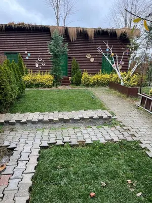 a garden with a stone path in front of a building at Flamingo Sapanca in Sapanca
