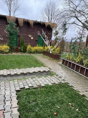 a garden with a brick path in front of a building at Flamingo Sapanca in Sapanca