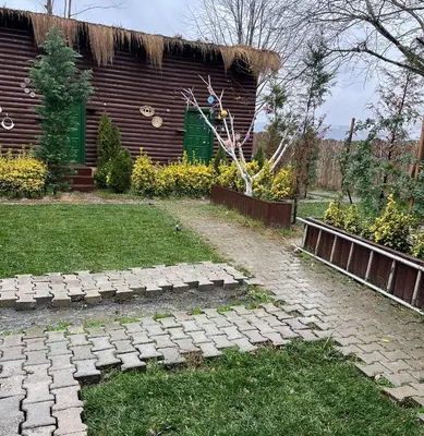 a garden with a brick path in front of a building at Flamingo Sapanca in Sapanca