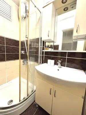 a bathroom with a sink and a shower at Pink House - Central Location by Seashore, Fiber Internet in Istanbul