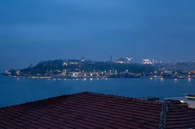 a view of a large body of water at night at Luxury Stay with Panoramic Bosphorus View in Istanbul