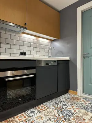 a kitchen with a sink and a stove at Gezgin Residence in Istanbul