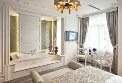 a bathroom with a tub and a sink at Mirrors Hotel İstanbul Taksim City Center in Istanbul