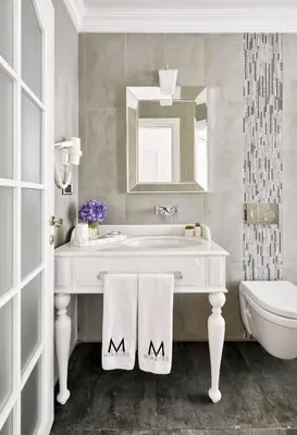 a bathroom with a sink and a tub and a mirror at Mirrors Hotel İstanbul Taksim City Center in Istanbul