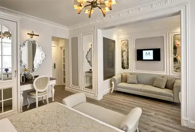 a living room with a couch and a tv at Mirrors Hotel İstanbul Taksim City Center in Istanbul