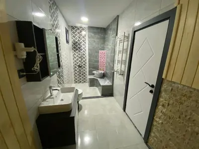 a bathroom with a sink and a shower and a toilet at Ağva Capella Hideaway Hotel in Sile