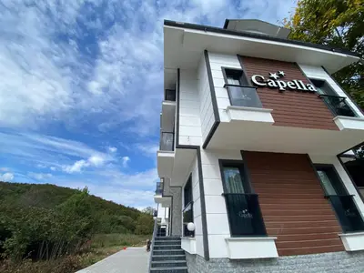 a building with a sign on the side of it at Ağva Capella Hideaway Hotel in Sile