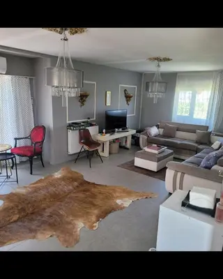 a living room with a couch and a table at villa SM in Çatalca