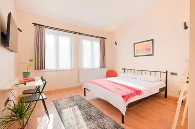 a bedroom with a bed and a desk at Casa Nozze 3 in Istanbul