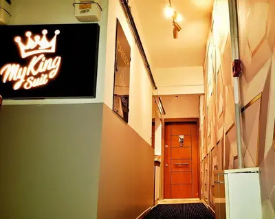a hallway with a sign on the wall of a building at My King Suit in Istanbul