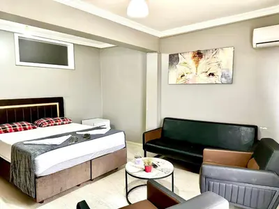 a living room with a bed and a couch at My King Suit in Istanbul