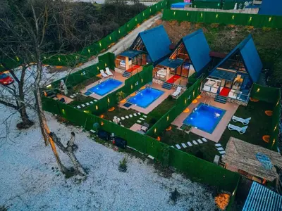 an aerial view of a house with two swimming pools at Mert Bungalov-Yıldız Evi in Sapanca
