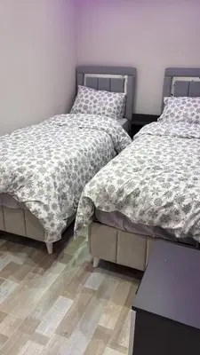 two beds sitting next to each other in a bedroom at Amora Suites in Istanbul