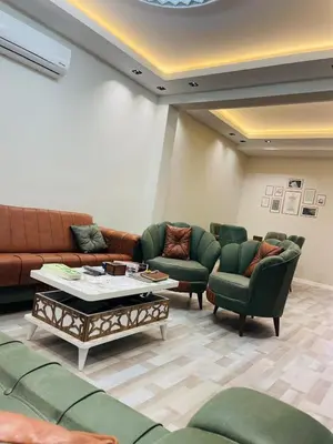 a living room with a couch and chairs and a table at Amora Suites in Istanbul
