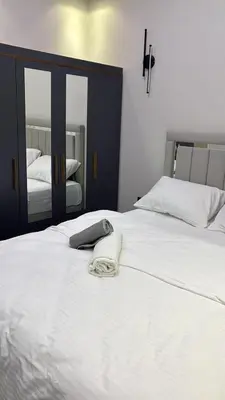 a white bed with a towel on top of it at Amora Suites in Istanbul
