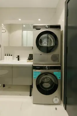 a kitchen with a washing machine and a sink at DeCamondo Residence Karaköy in Istanbul