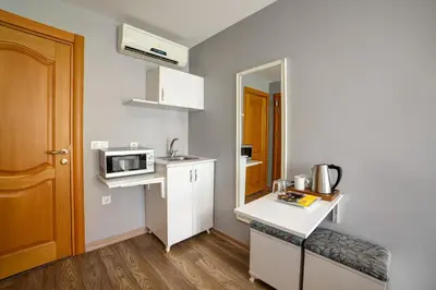 a small kitchen with a sink and a microwave at ELİTE HOTEL By MK in Istanbul
