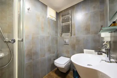 a bathroom with a toilet and a sink and a shower at ELİTE HOTEL By MK in Istanbul