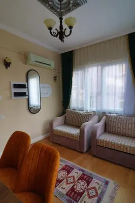 a living room with two couches and a mirror at Stone Home Apart in Istanbul