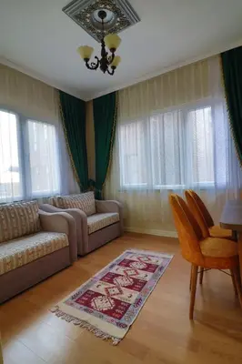 a living room with a couch and a table at Stone Home Apart in Istanbul