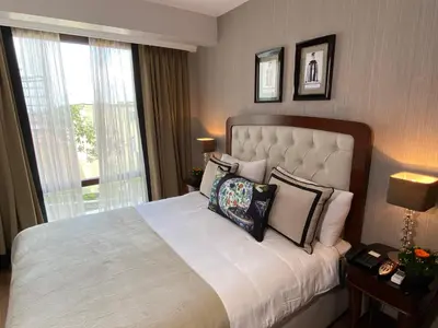 a bedroom with a large bed with pillows on it at Four Doors Hotel in Istanbul