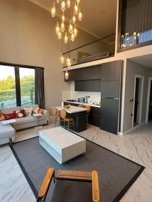 a living room with a couch and a table at Loft Sabırlı in Kaynarca