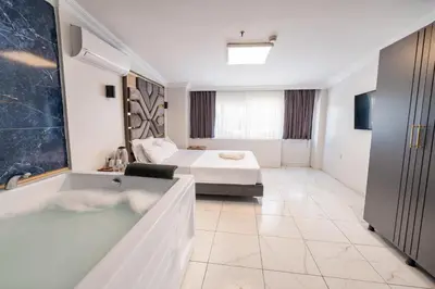 a hotel room with a bed and a bath tub at Highway 34 Hotel in Istanbul